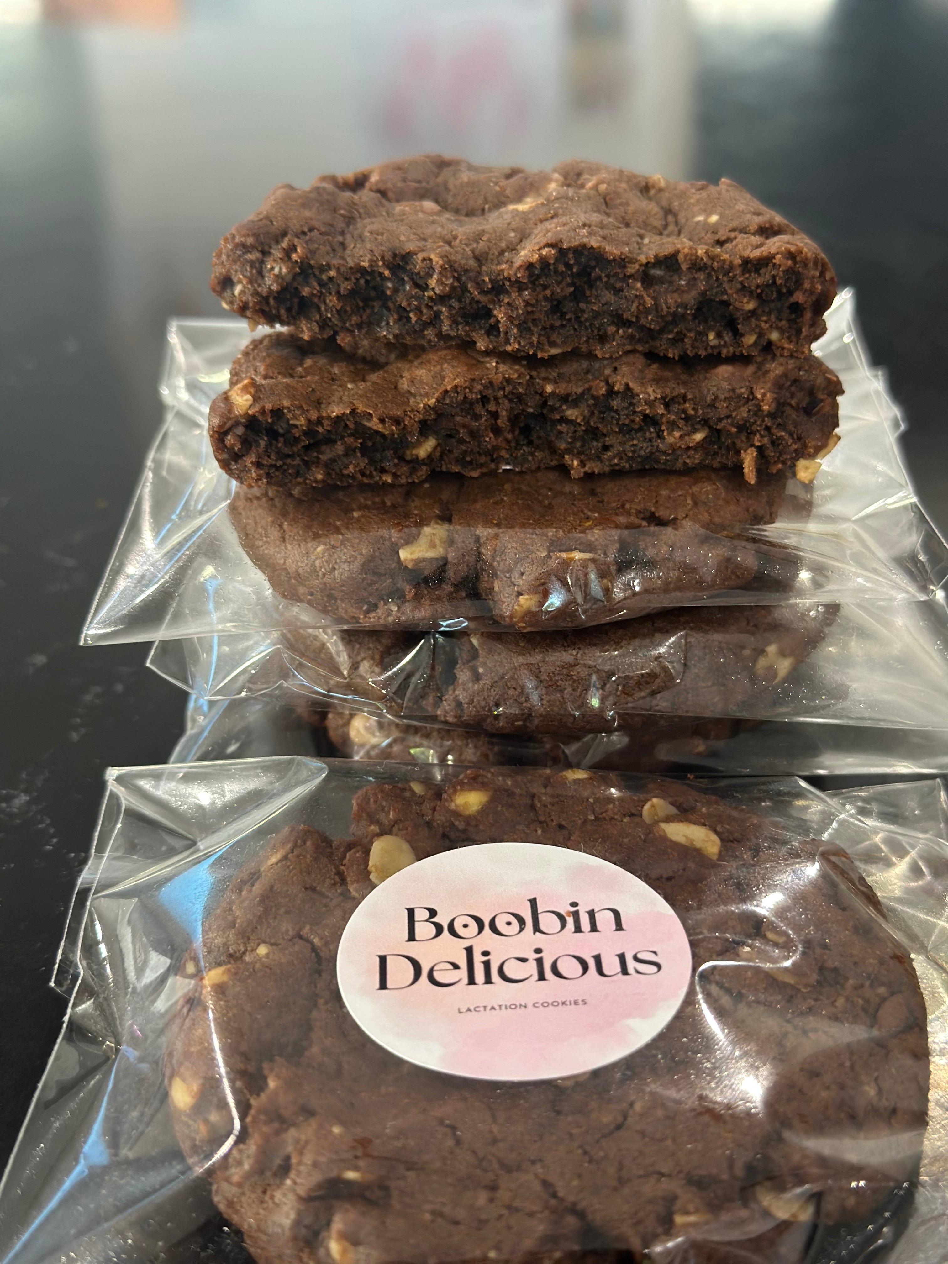Chocolate Brownie Vegan Lactation Cookies with broken open cookie