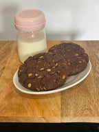 Original Double Chocolate Lactation Cookies on plate with pumped milk