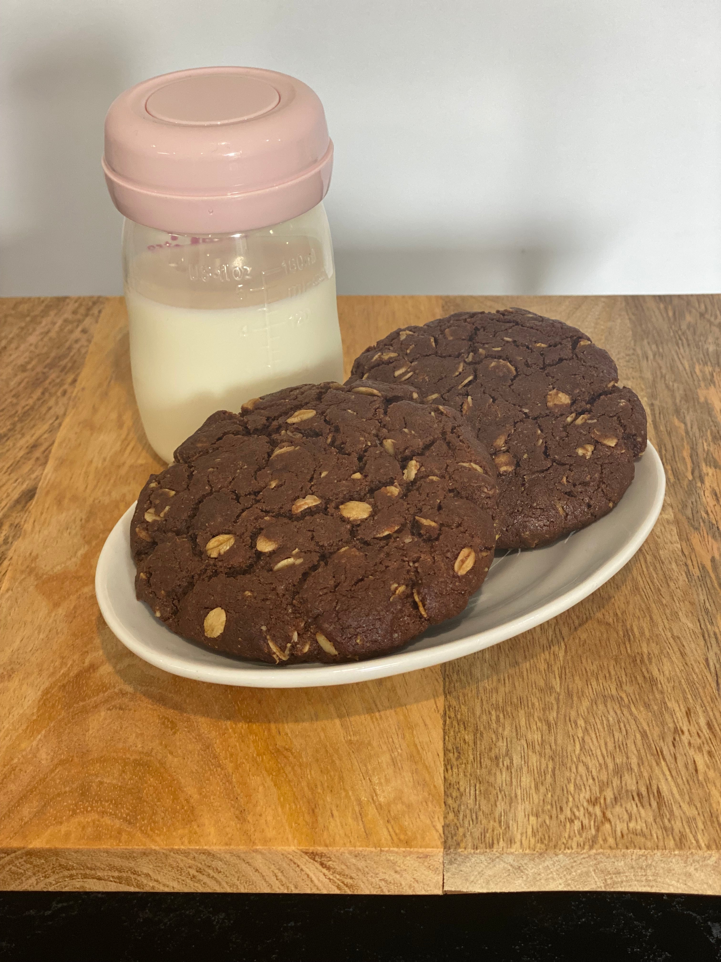 Original Double Chocolate Lactation Cookies on plate with pumped milk
